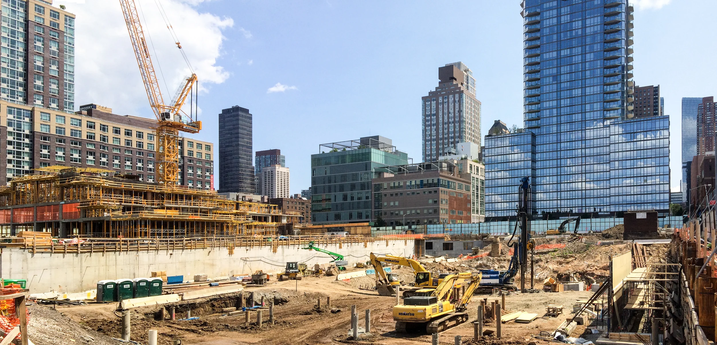 The construction site of Riverside Center with Building 2 (left) above ground and foundation work for Building 5 (right) underway.