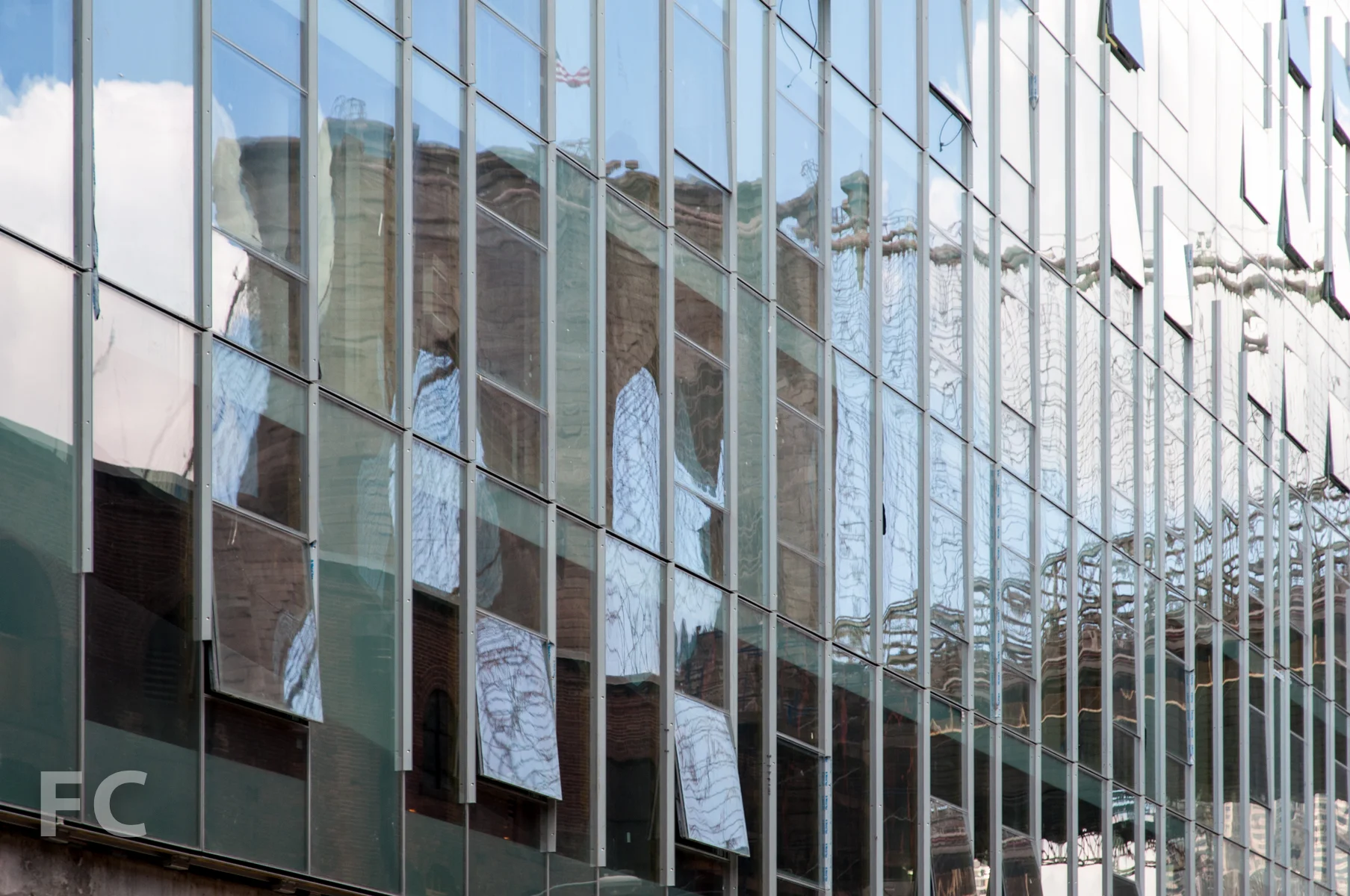 Reflection of the Brooklyn Bridge in the curtain wall.