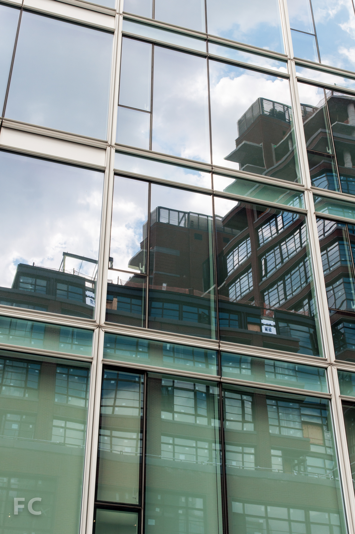 150 Charles reflected on the glass curtain wall of 165 Charles.