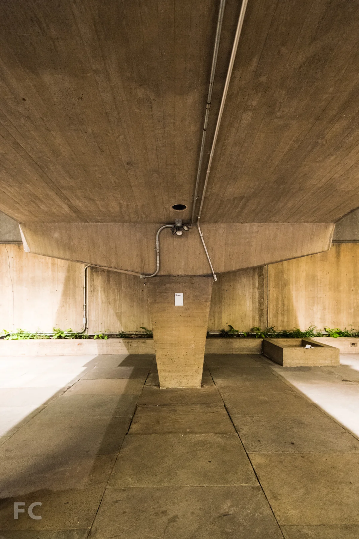 Underneath the entry bridge in the sunken court.