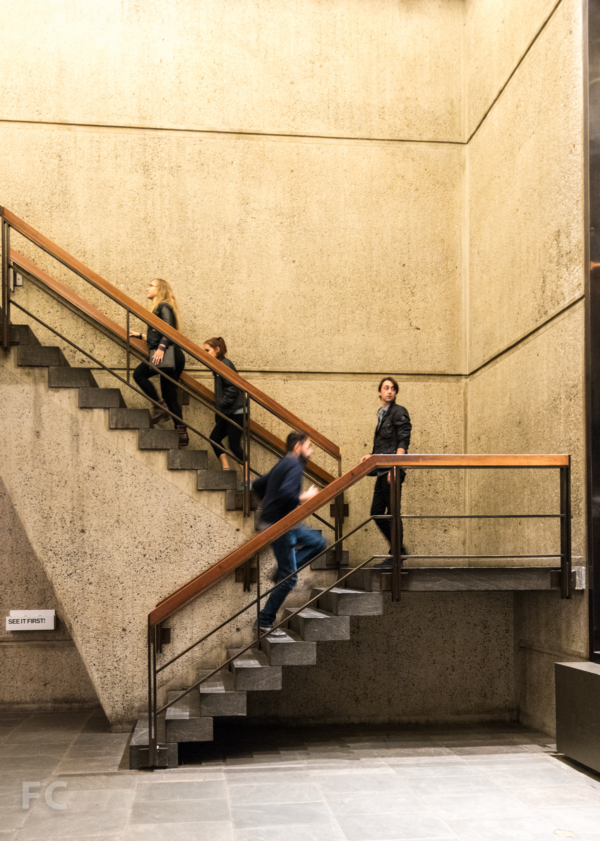 Open stair from the lobby down to the sunken court.
