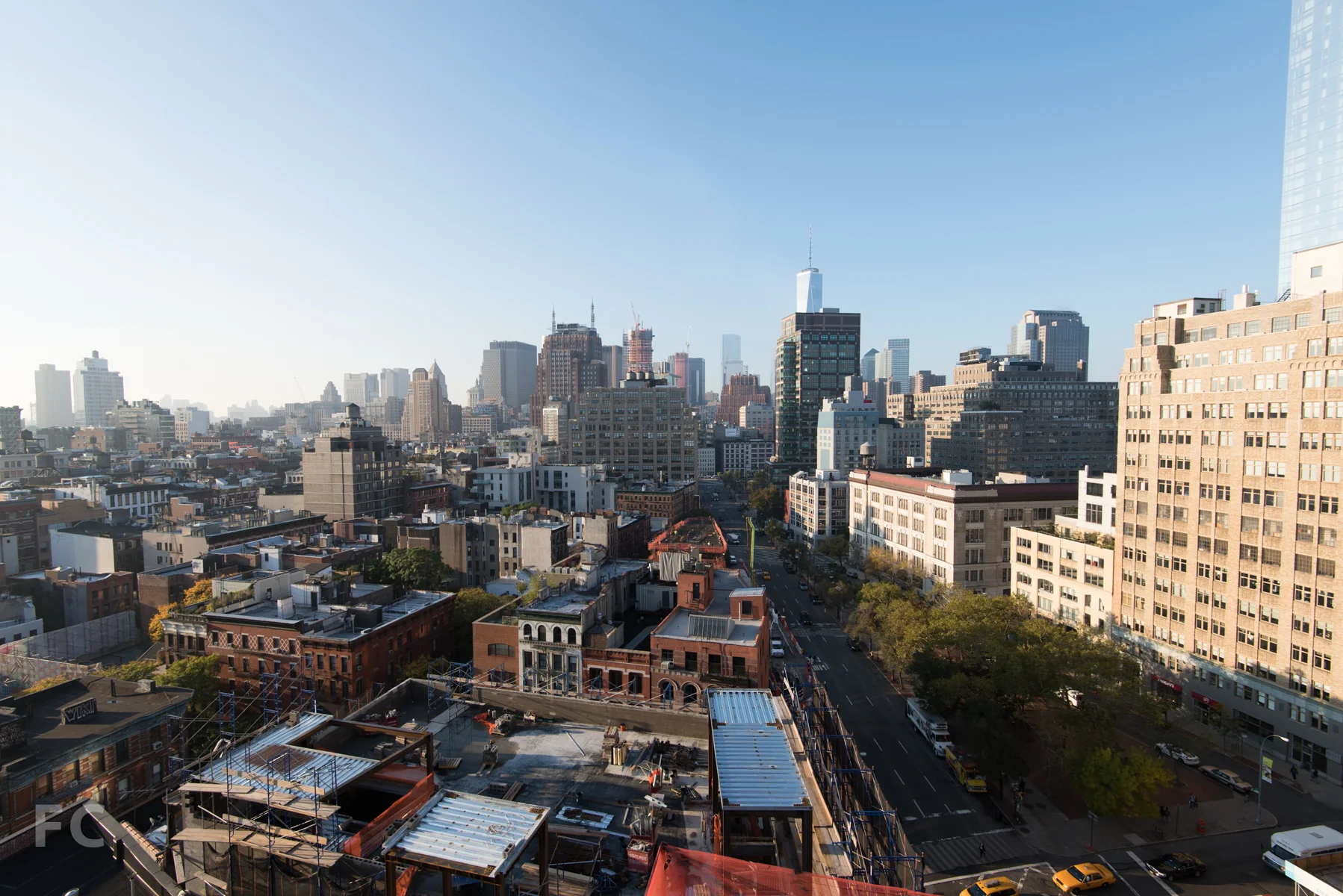 Looking south from the Penthouse A roof terrace, with 166 Avenue of the Americas (foreground) and Tamarkin's 10 Sullivan Street under construction. Construction on 56 Leonard and 30 Park Place is also visible in the distance.