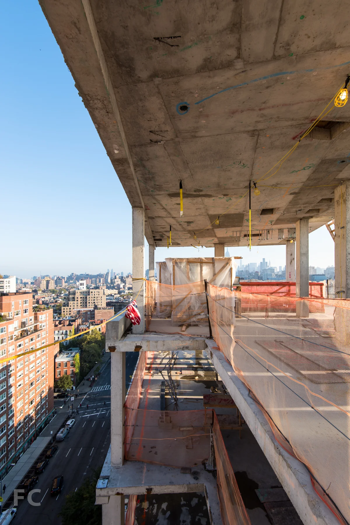 Penthouse A's triple height stair volume at the rooftop living room.