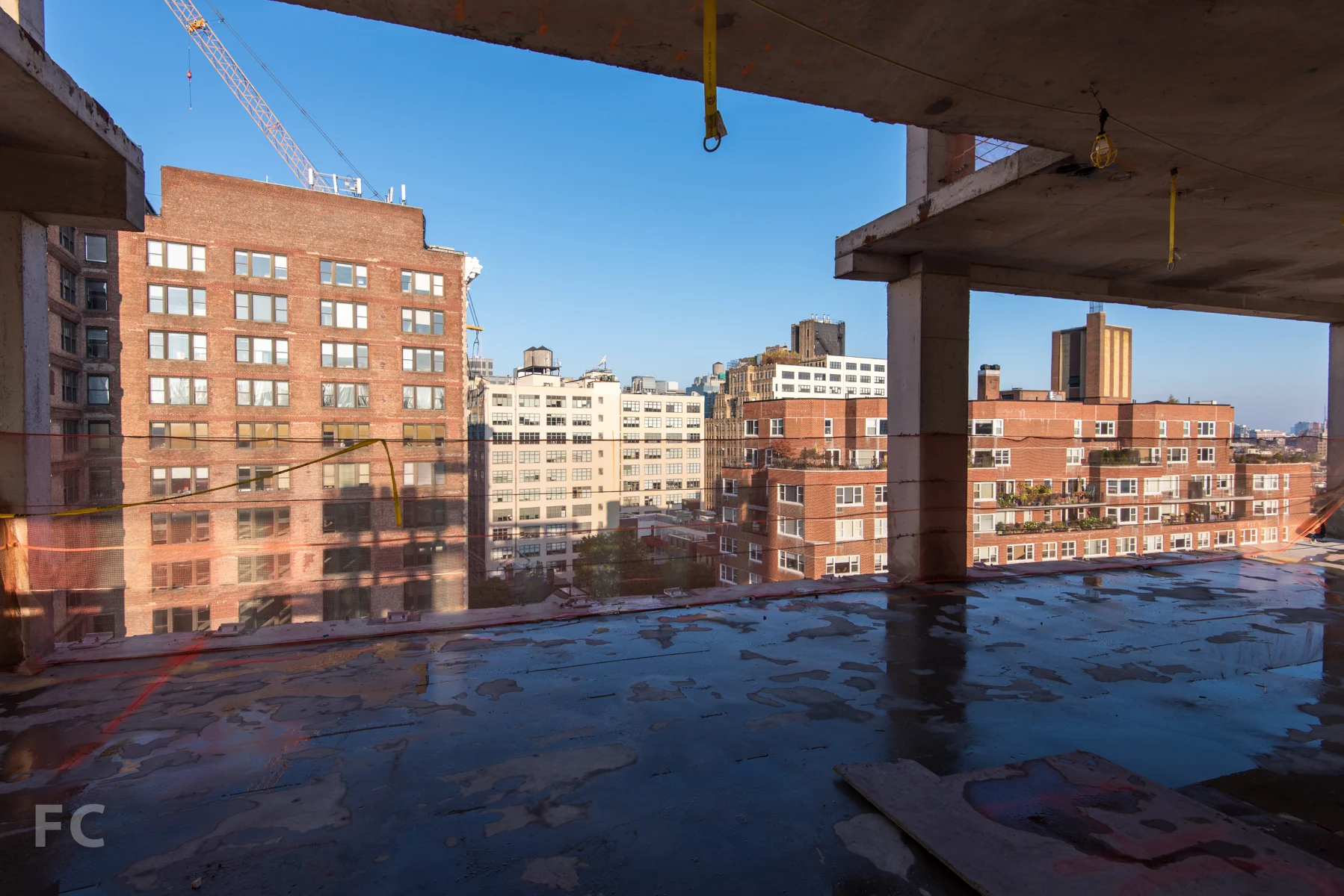 Looking west toward the triple height stair from the main entry and gallery of Penthouse A on Floor 12.