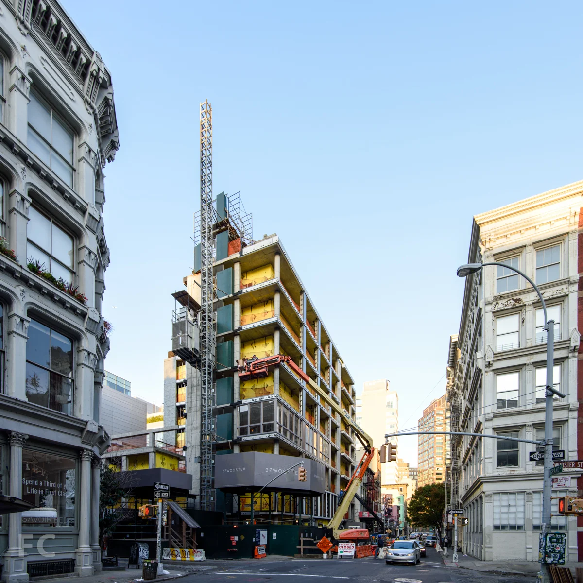 The northeast corner at the intersection of Grand Street and Wooster Street.