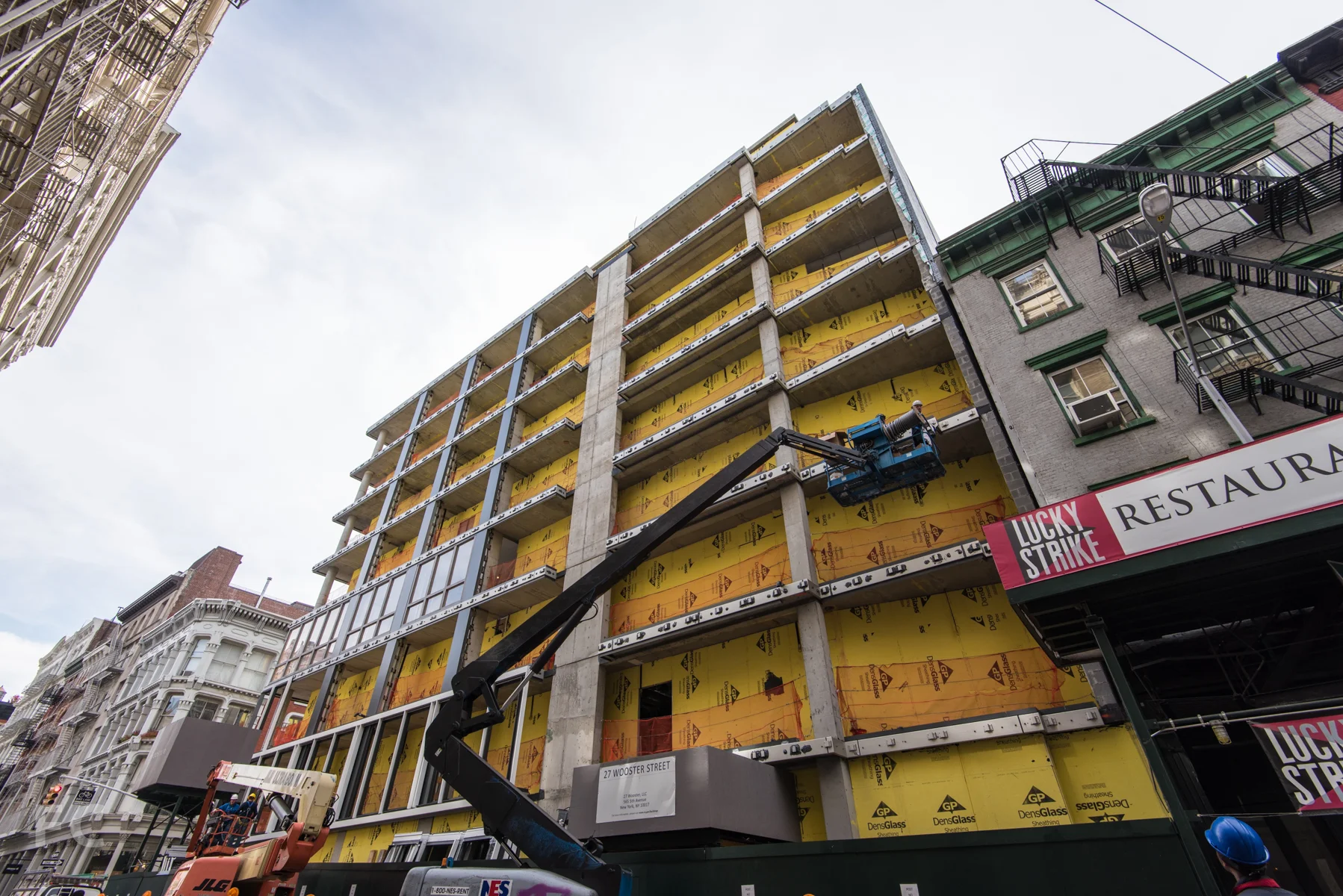 The north facade facing Grand Street.