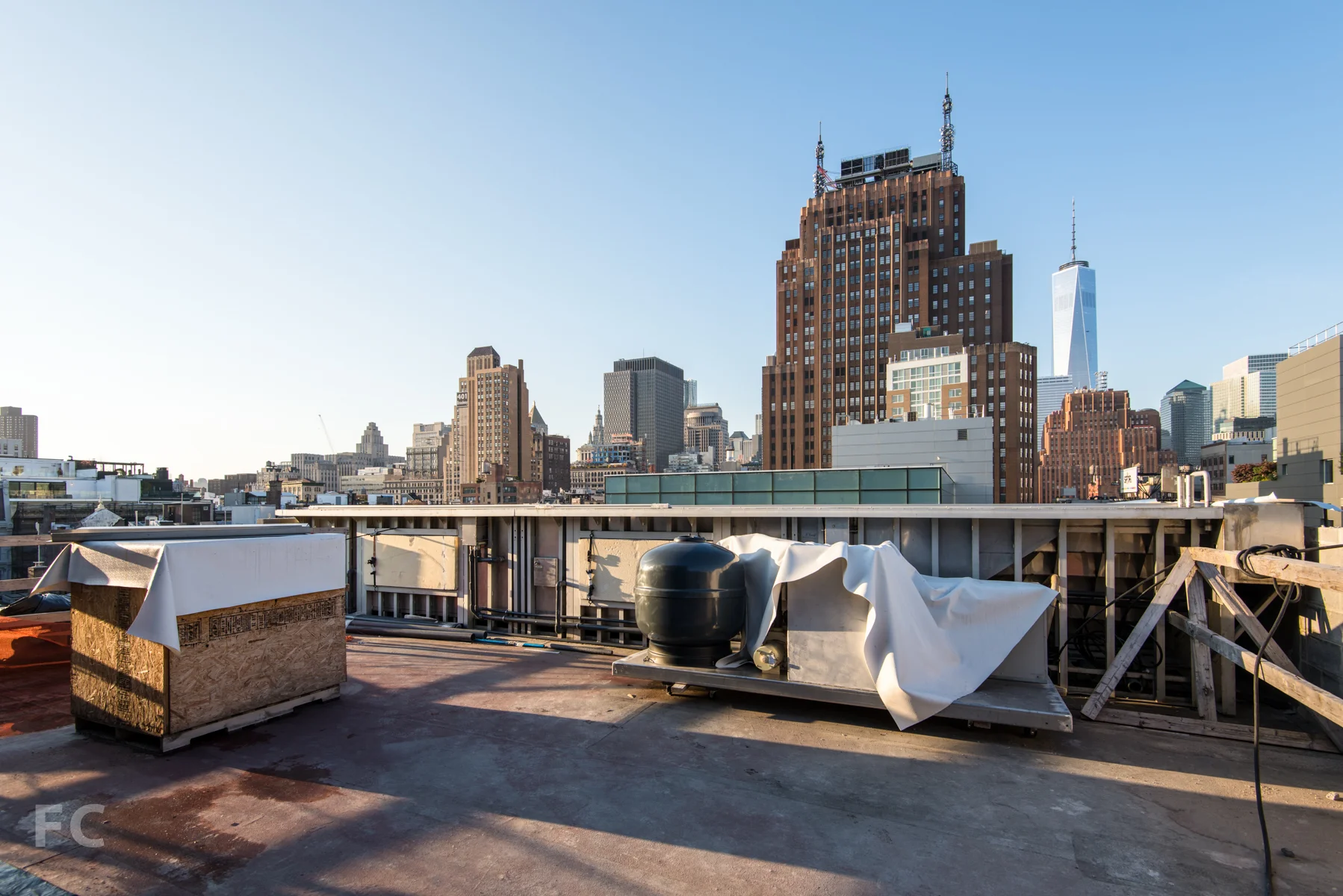 The pool enclosure with windows on the penthouse roof deck.
