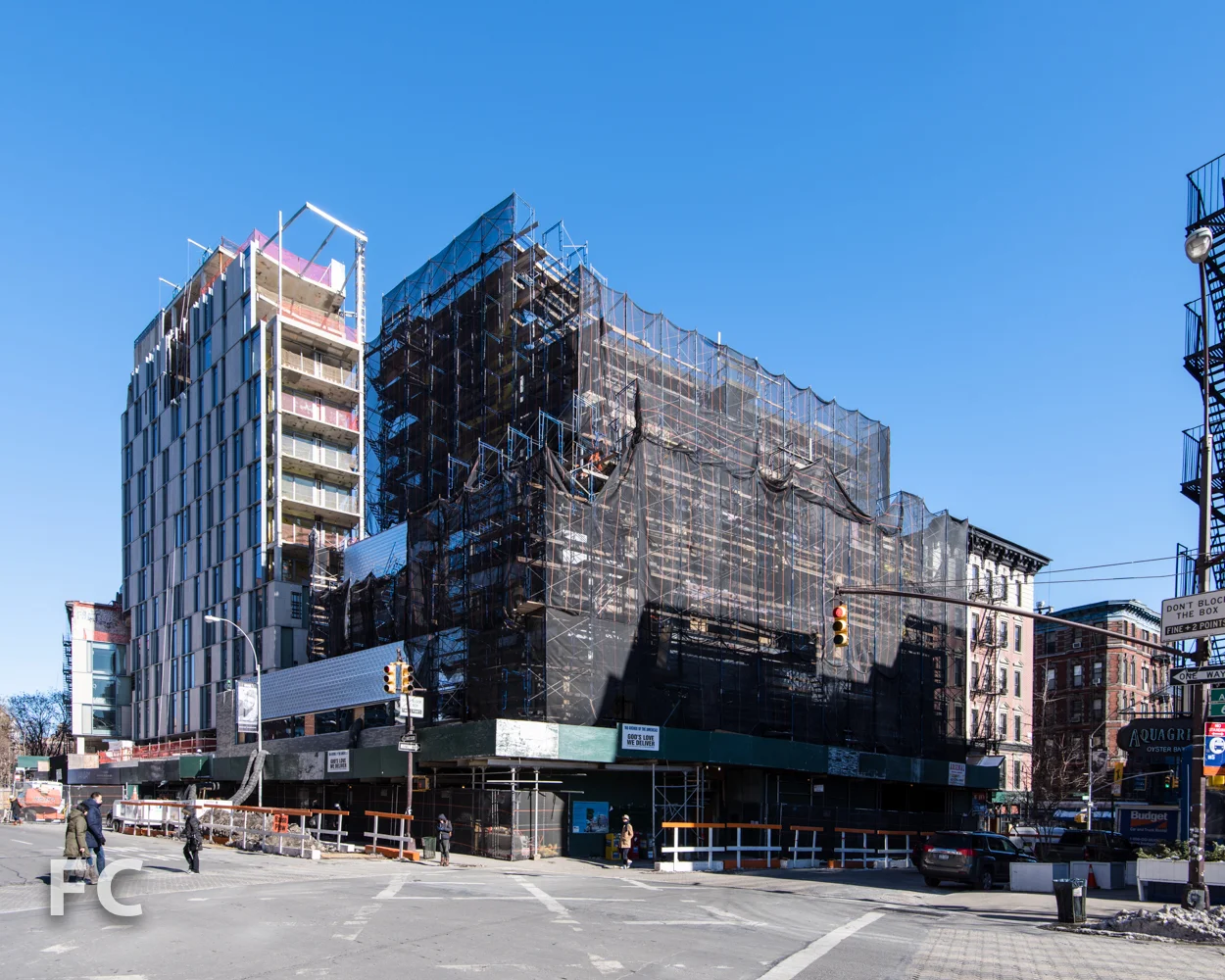 Southwest corner of 166 Avenue of the Americas (right) and One Vandam (left).