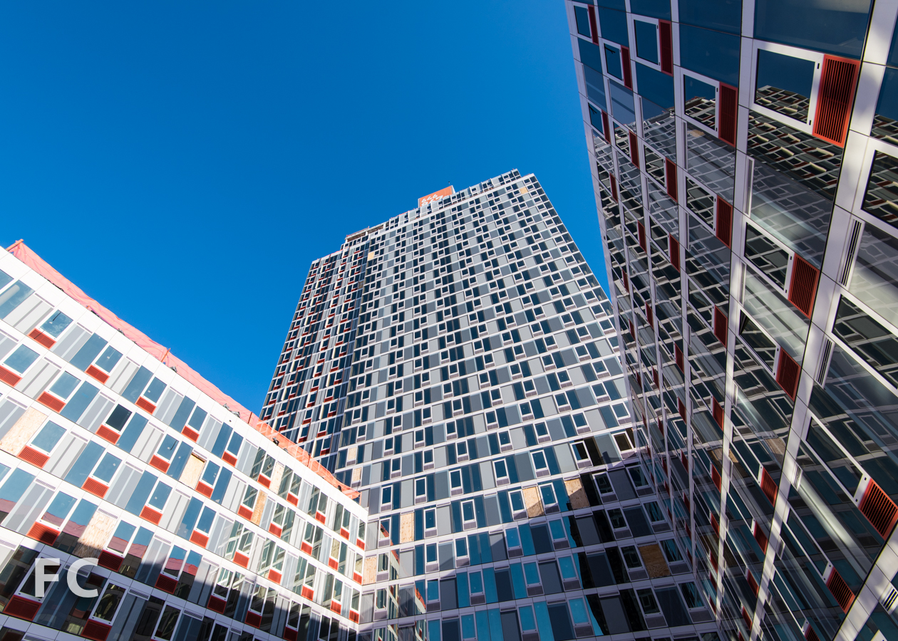 South facade of Hunter's Point South Commons from the lower podium rooftop terrace.