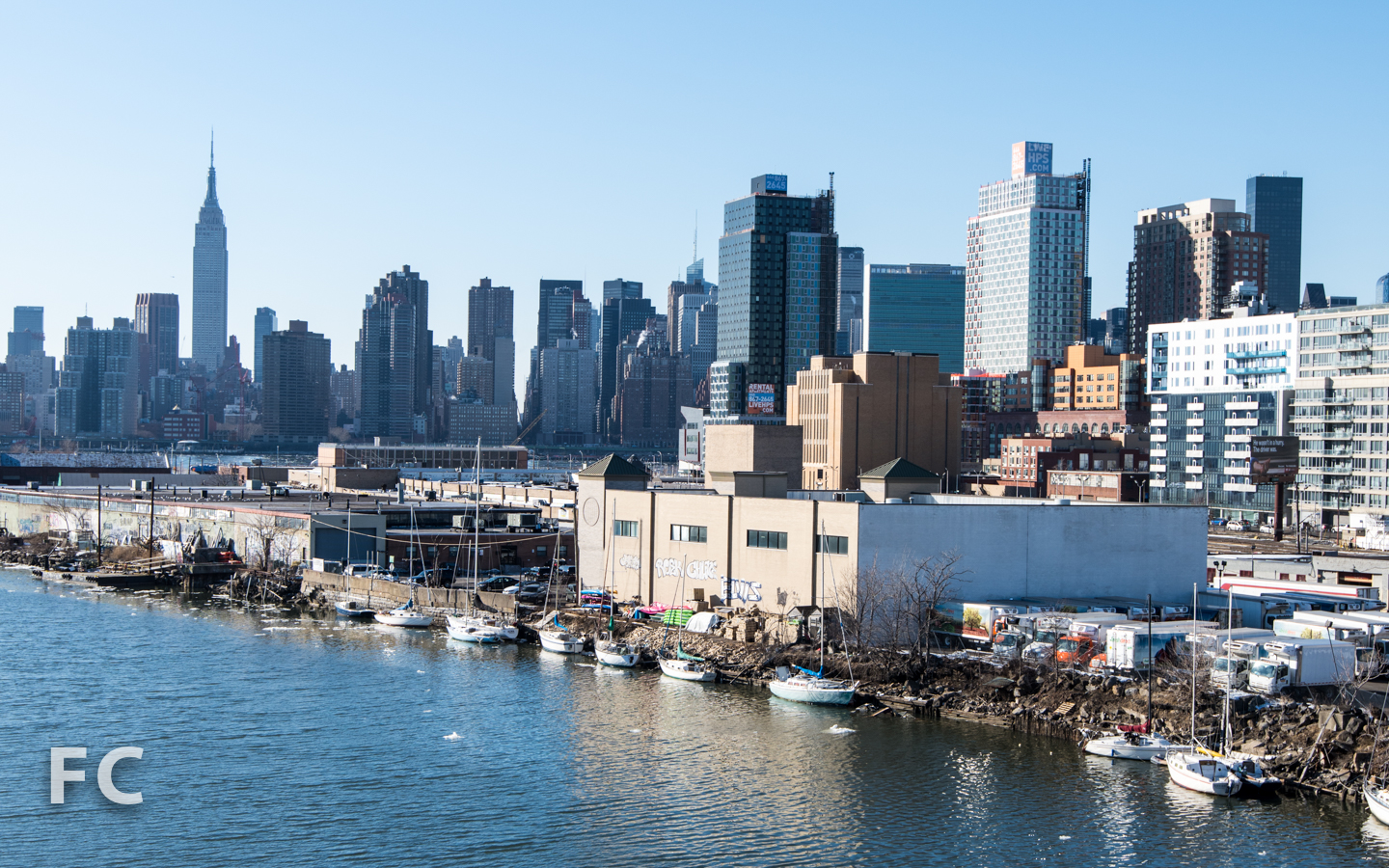 View of Hunters Point South (right) and the Manhattan skyline (left) from the Pulaski Bridge.