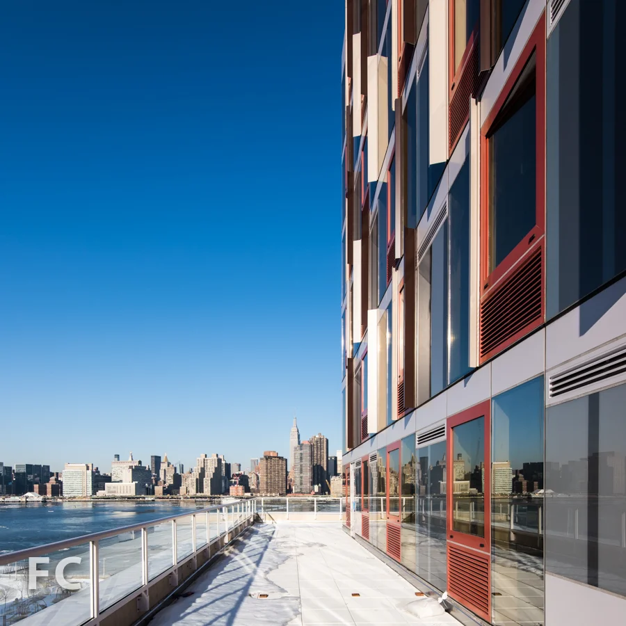 View of the Manhattan skyline from a podium terrace on Hunter's Point South Commons.