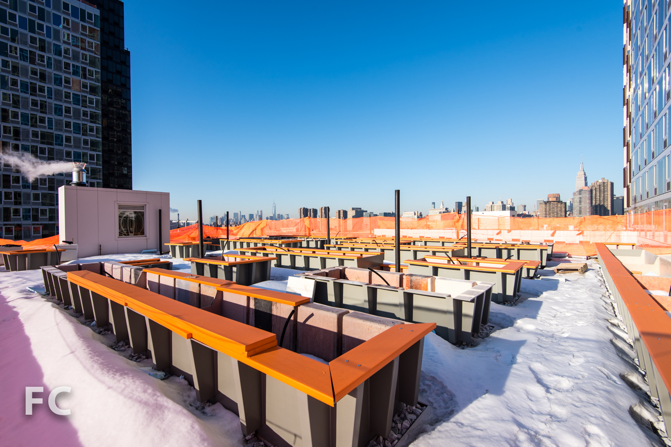 Plant bed troughs for the future roof garden on a rooftop terrace of Hunter's Point South Commons.