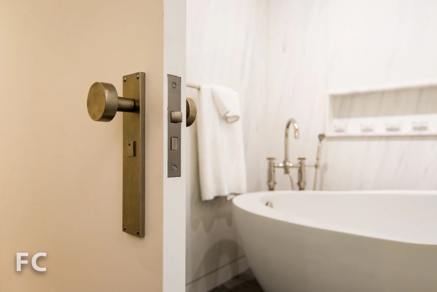 Custom door hardware in the master bathroom.