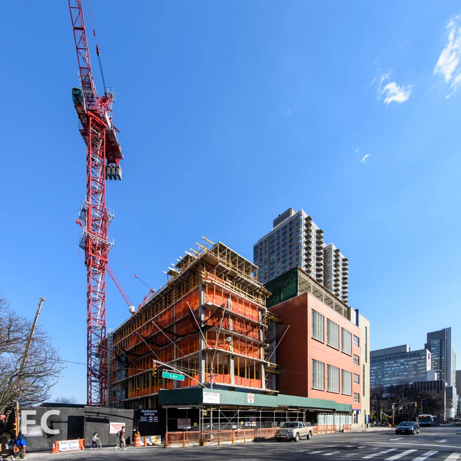 The northwest tower (left) and P.S. 281 (right) from First Avenue.