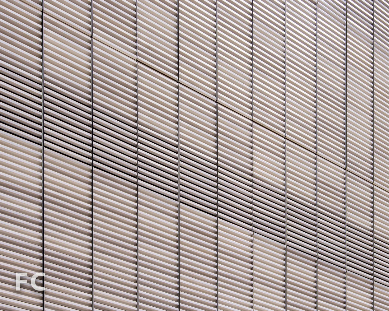 Detail of the terra cotta facade at the retail podium.