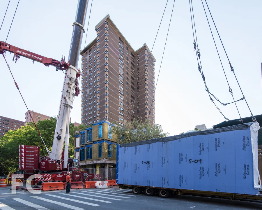Module on site preparing to be lifted for stacking.