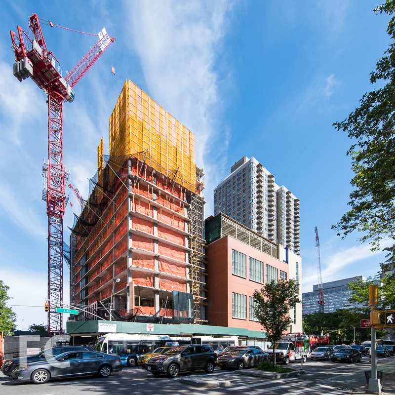 The northwest tower (left) and P.S. 281 (right) from First Avenue.
