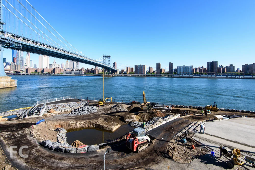 Looking northwest towards Lower Manhattan (background) and the John Street park (foreground).