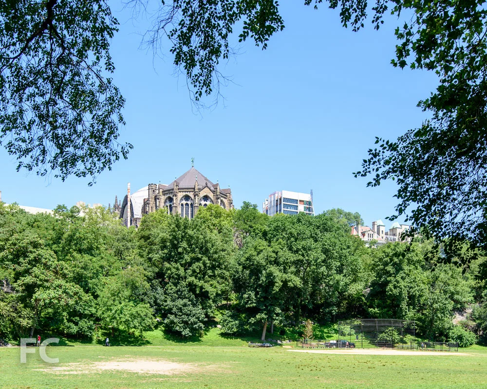 A southeast view of the east tower (right) and the cathedral (left) from Morningside Park.