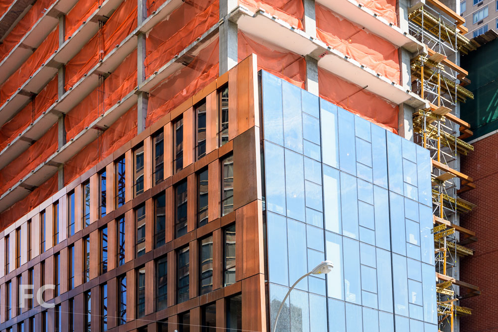 Closeup view of the copper and glass facade on the northwest corner of the north tower.