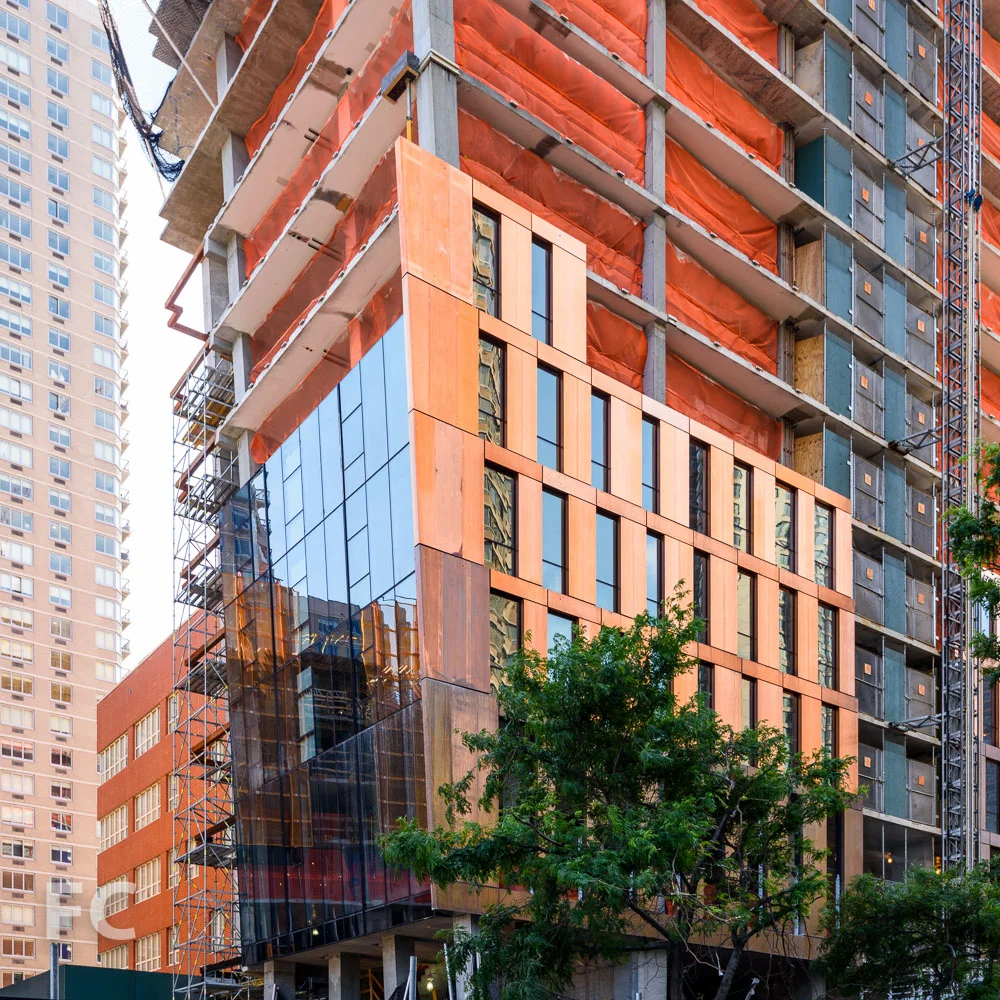 Closeup view of the copper and glass facade of the northeast corner of the north tower.