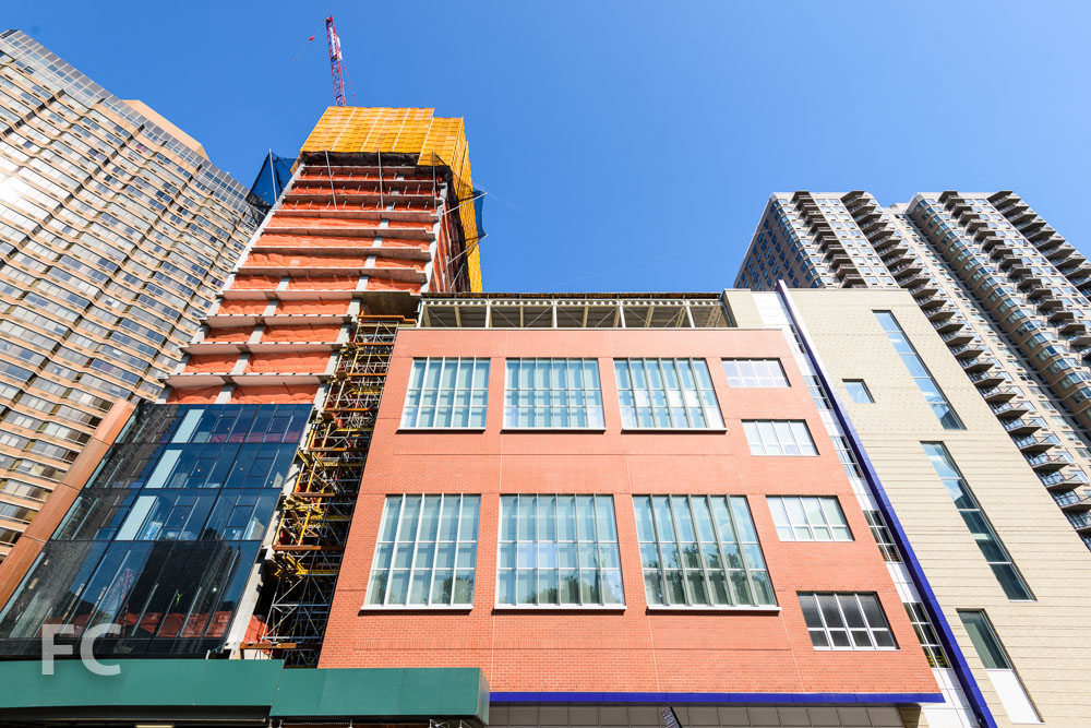Looking up at the west facade of the north tower (left)&nbsp;from First Avenue.