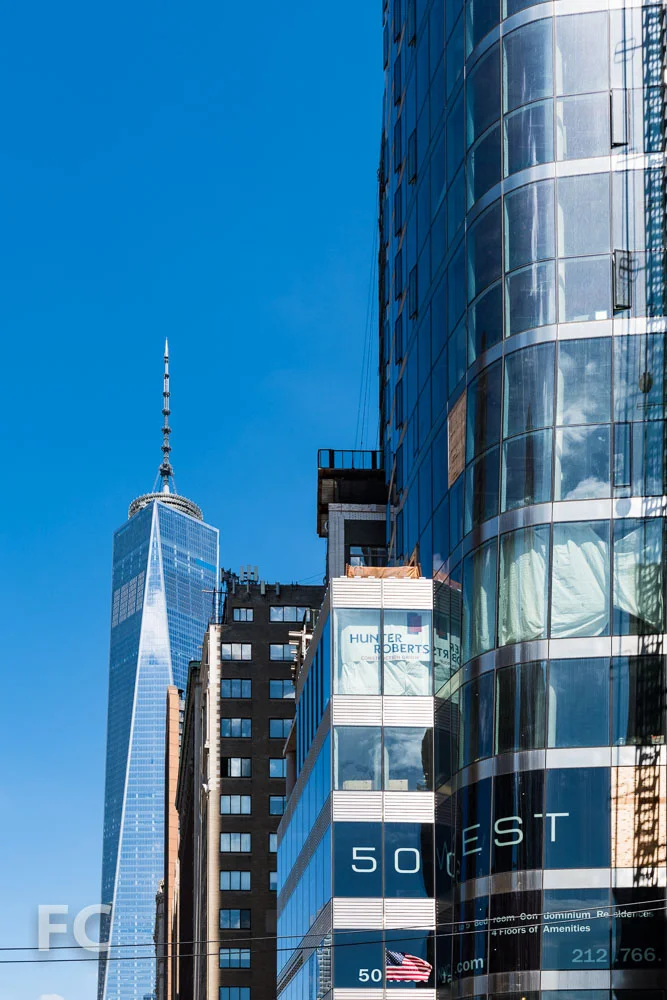 Close-up of the southwest corner of 50 West (right) and One World Trade Center (left).