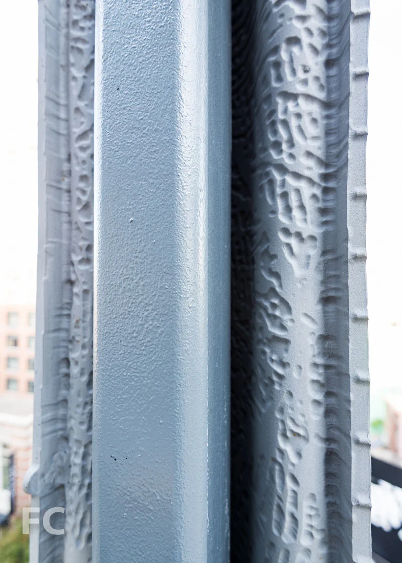 Hand imprint on the interior face of the facade screen.