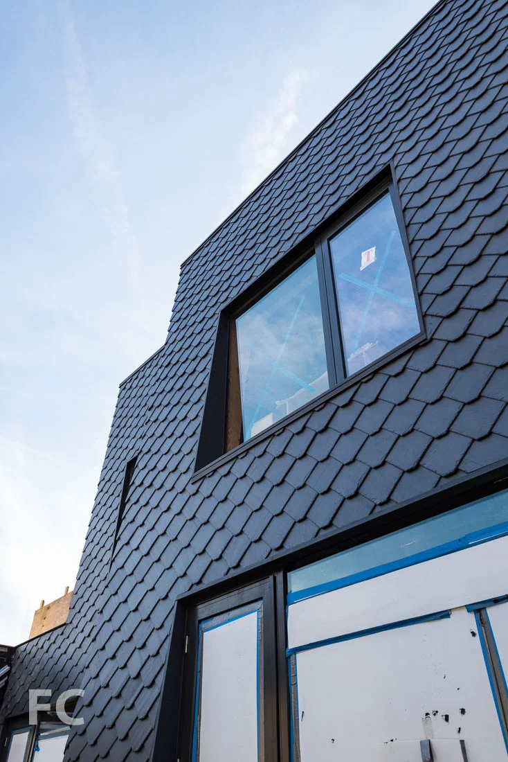 Slate shingled facade of the penthouse.
