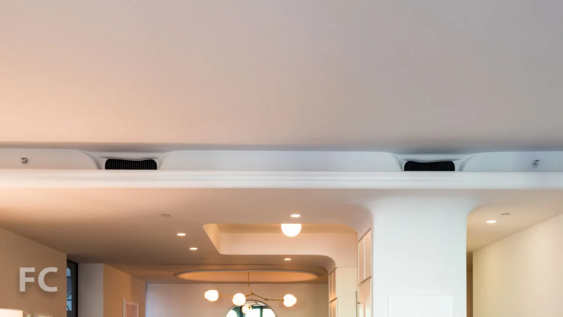 Living room soffit to conceal sprinklers and air conditioning vents.