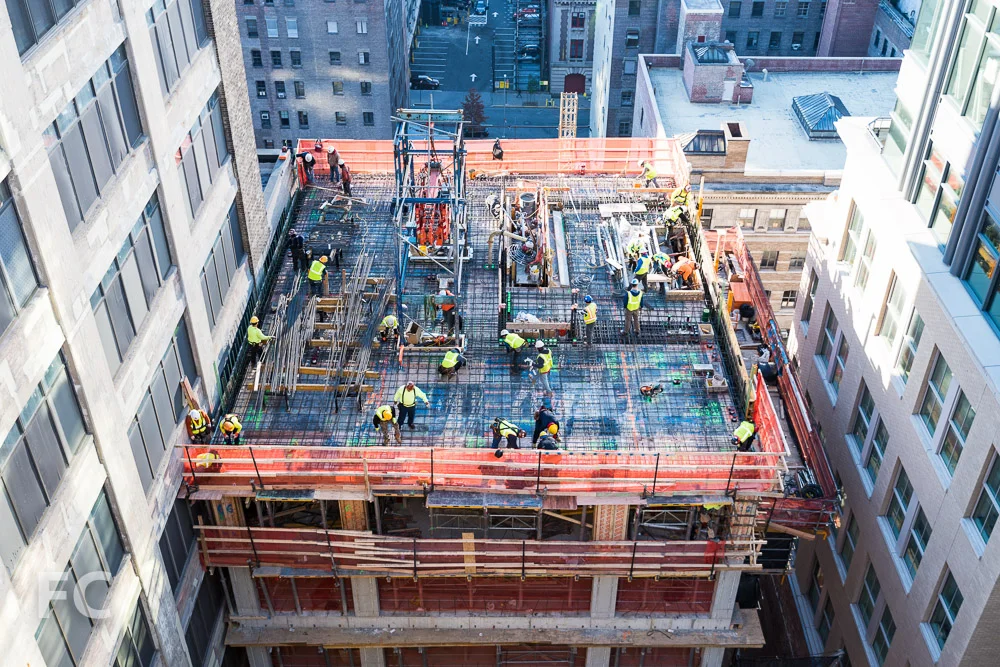 Workers prepare the 15th floor slab of the Vandam Street tower.