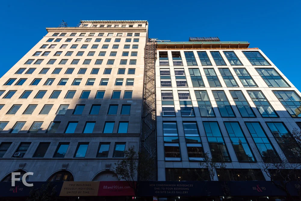 Looking up at the east façade of 88 Lexington (left) and 90 Lexington (right) from Lexington Avenue.