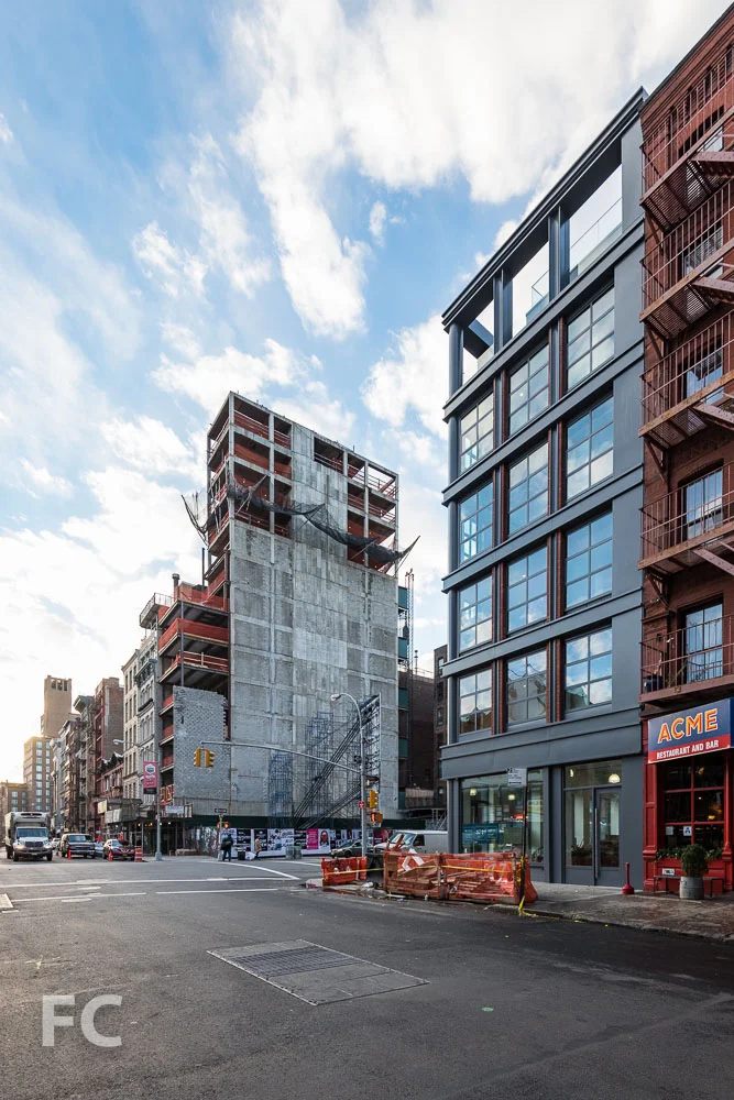 Looking east along Great Jones Street towards 22 Bond (left) and 372 Lafayette (right)..