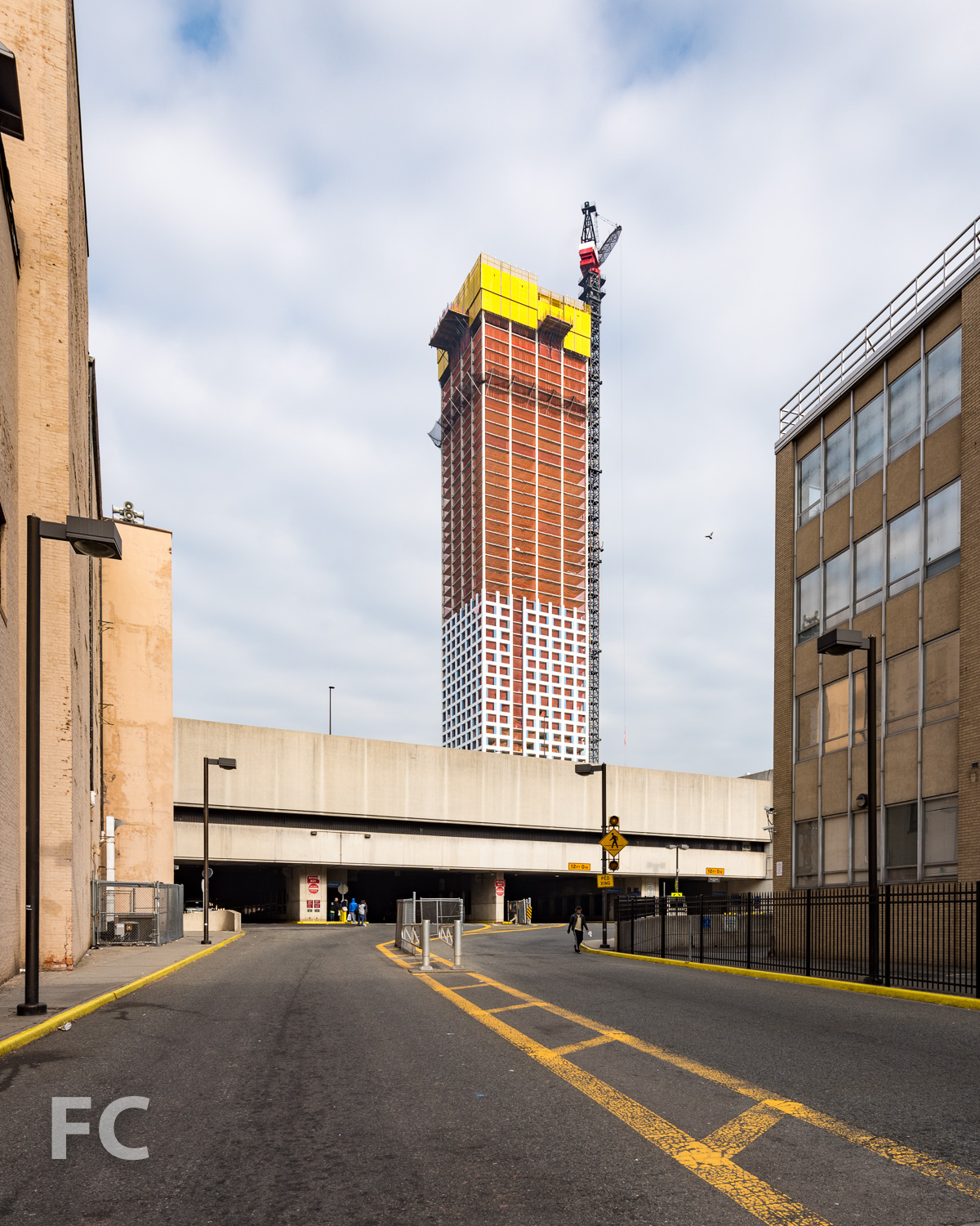 Southwest corner of the phase one tower (background) and the Journal Square Transportation Center (foreground).