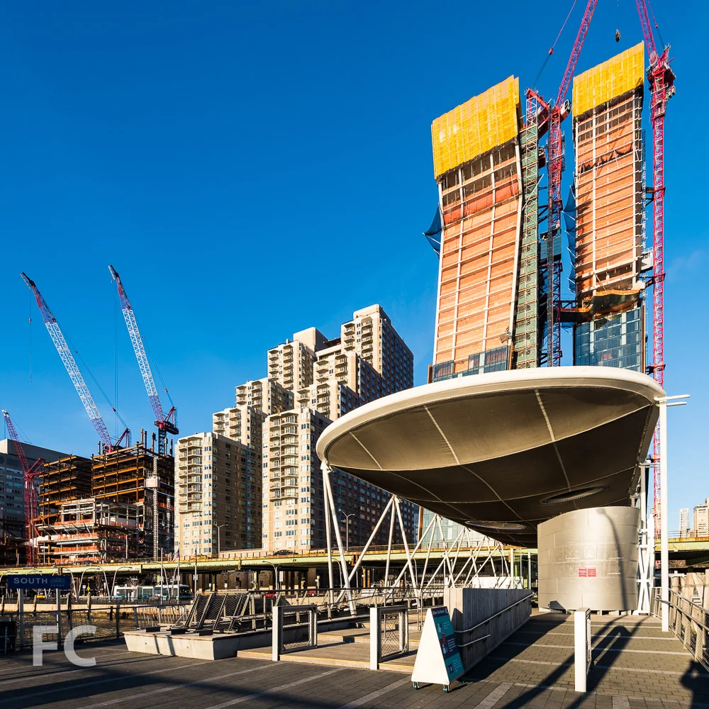 East facade of the north (right) and south (left) towers from the East River Ferry terminal at East 35th Street.