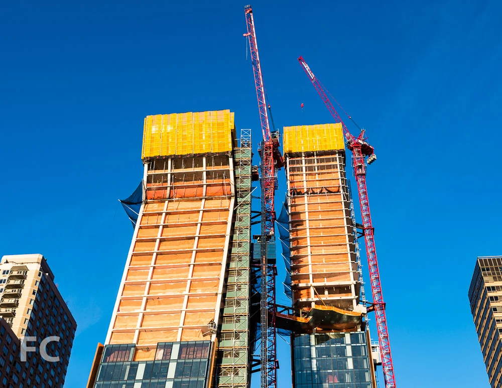 Looking up at the north (right) and south (left) towers from the East River ferry terminal.