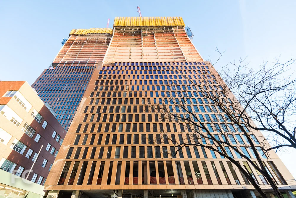 Looking up at the south facade of the north (left) and south (right) towers from East 35th Street.