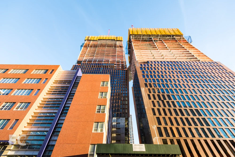 Looking up at the south facade of the north (left) and south (right) towers from East 35th Street.