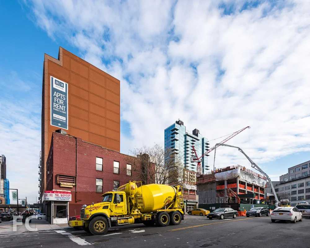 Northwest corner of Watermark Court Square (center) and 27-21 44th Drive (right).