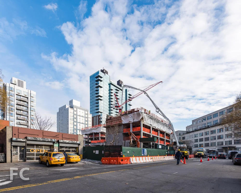 Northwest corner of Watermark Court Square (left) and 27-21 44th Drive (right).