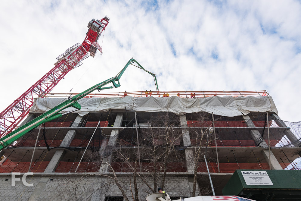 Looking up at the east facade of 44-28 Purves Street.