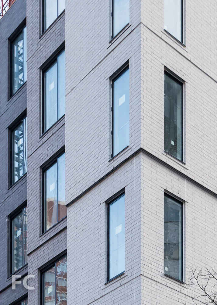Close-up of the brick facade at the southwest corner.
