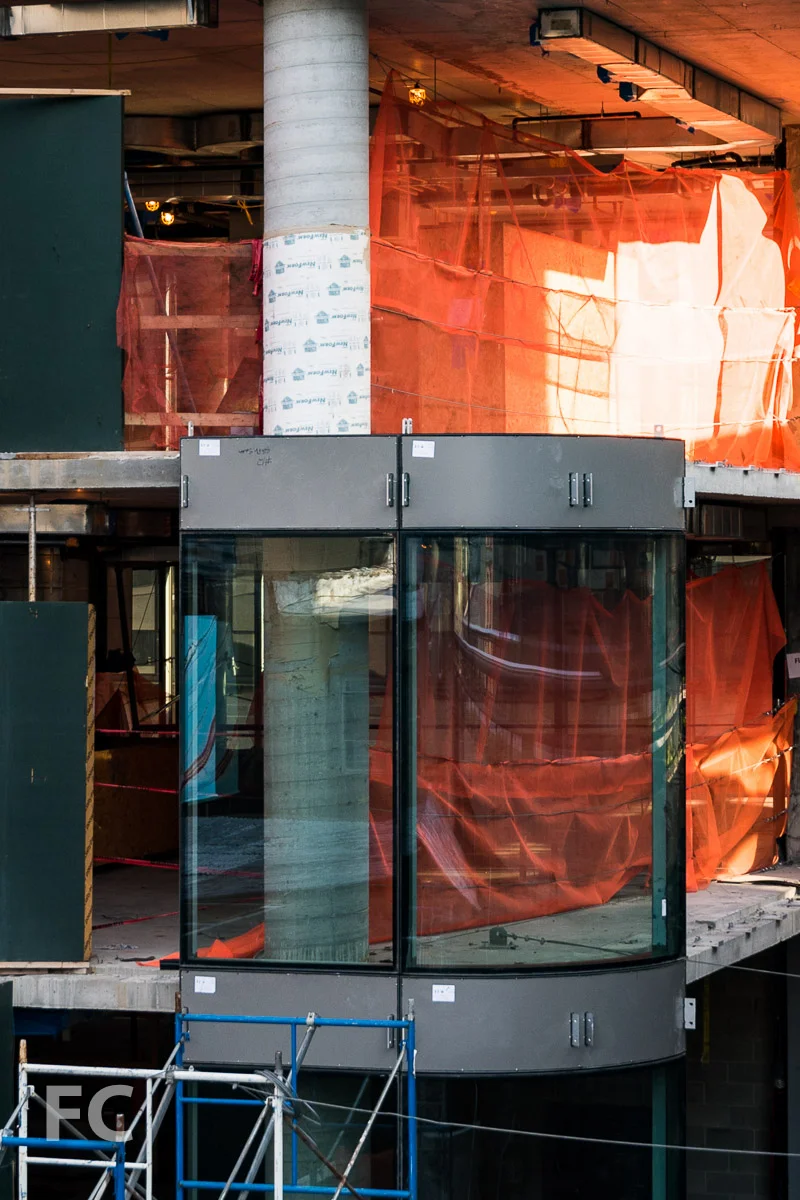 Curved glass curtain wall at the southeast corner.
