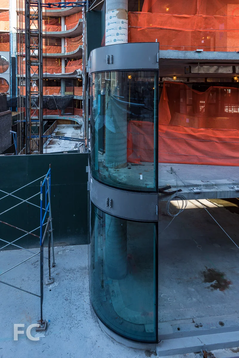 Curved glass curtain wall at the northeast corner.