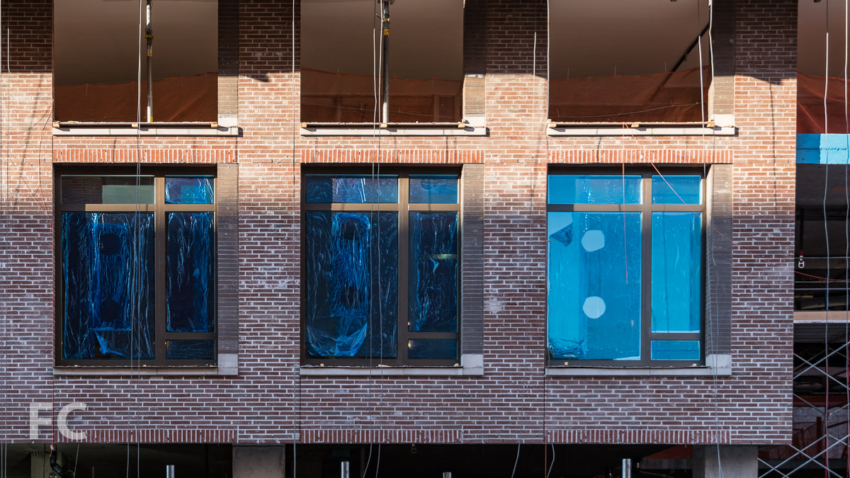 Close-up of the brick and glass facade at West 52nd Street.