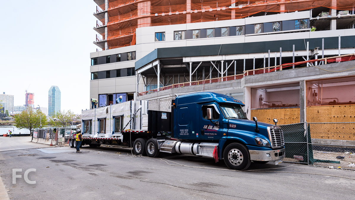 Facade panels awaiting installation on the Residential Building.