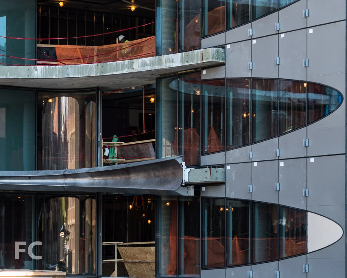 Detail of the metal facade installed at the southeast slab edge.