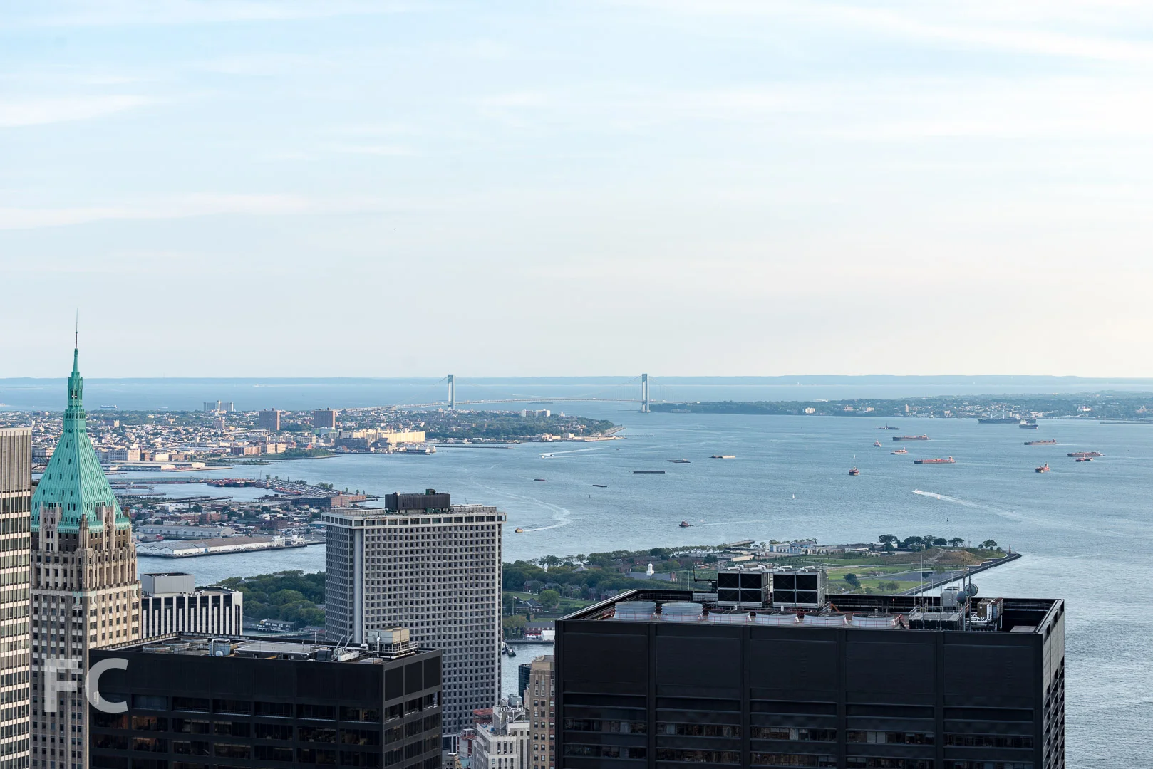 Governors Island and the evening rush hour traffic in the New York harbor.