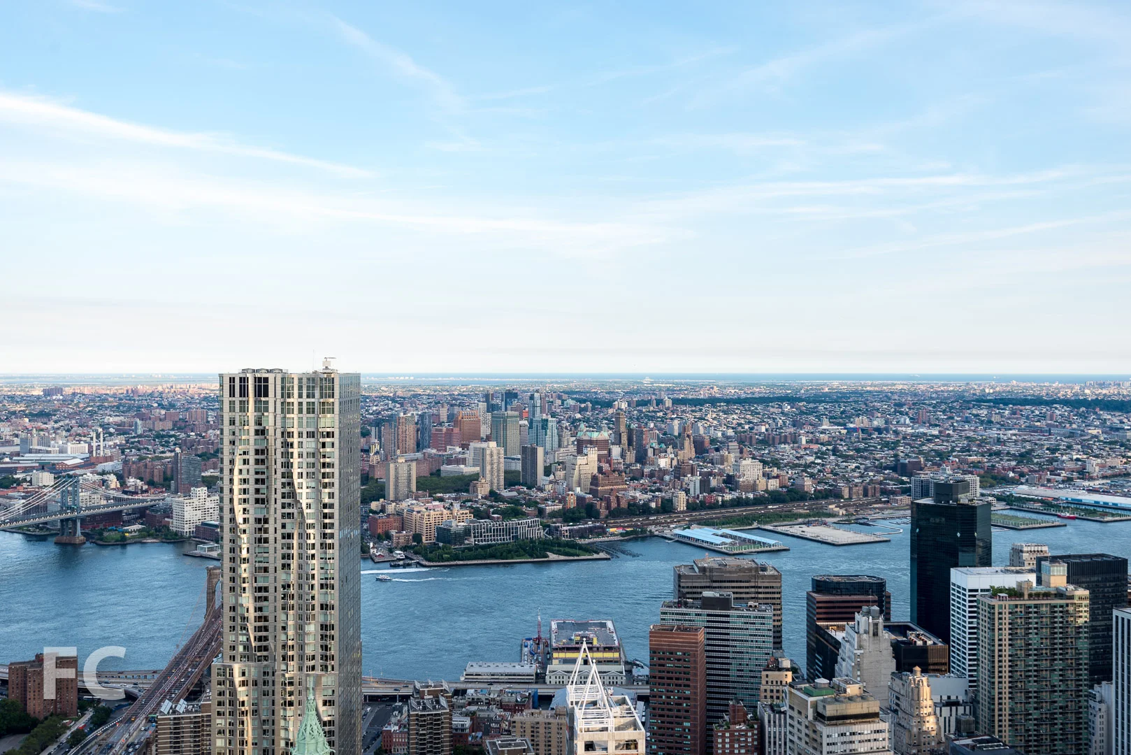 The Lower Manhattan skyline with Brooklyn Bridge Park and the Downtown Brooklyn skyline in the background.