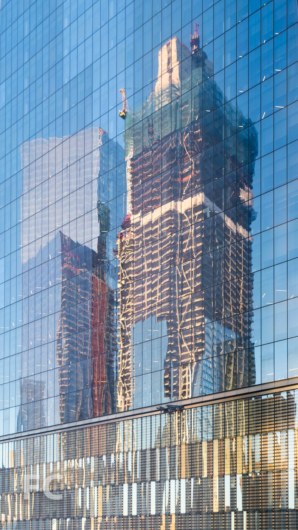 Reflections of 3 and 4 World Trade Center on the facade of 1 World Trade Center.